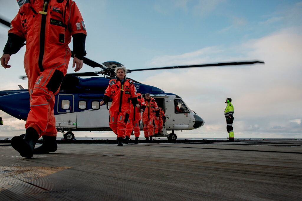 People walking out of helicopter on the Ringhorne platform.